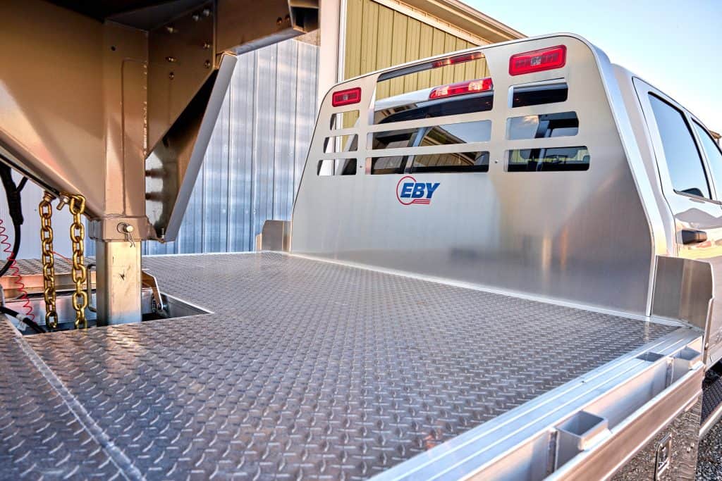 EBY flatbed truck body with headache rack and stake pockets