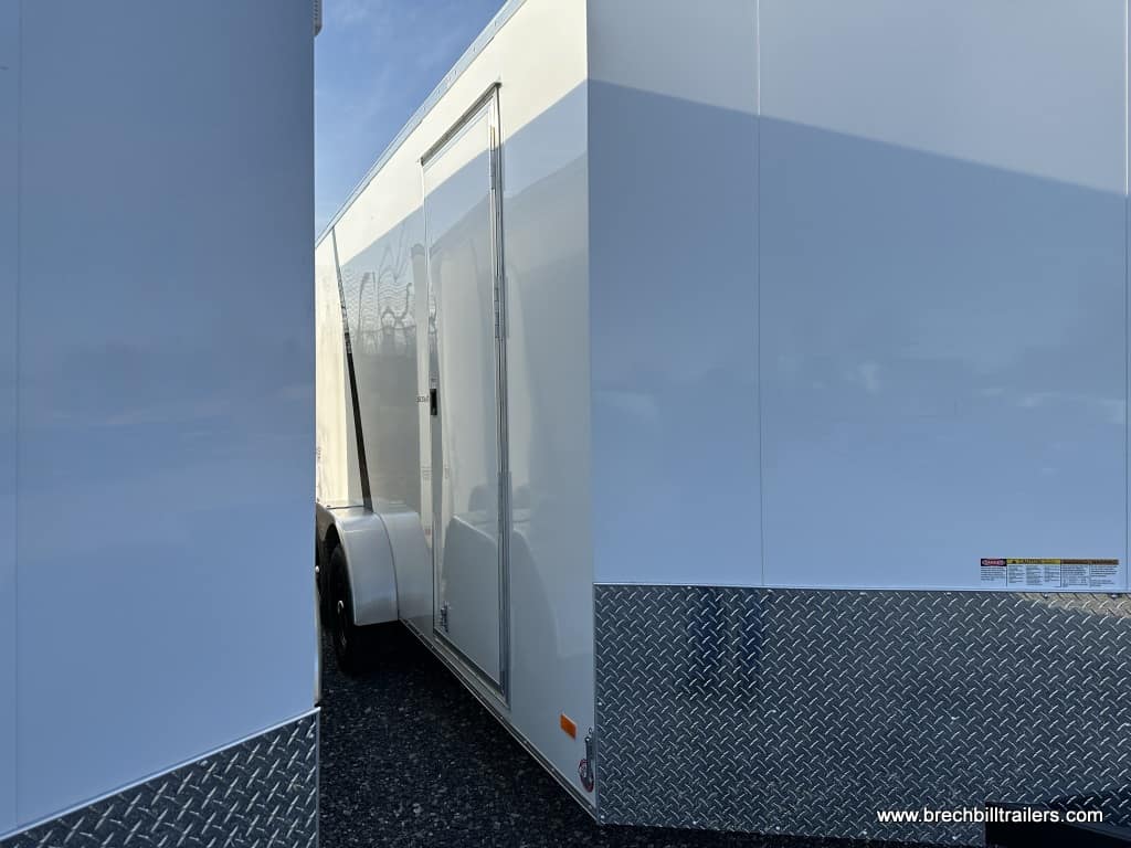A white Bravo Scout 7k enclosed cargo trailer for sale.