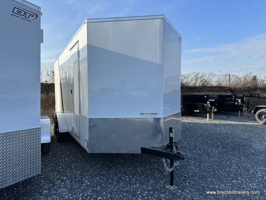 A brand new Bravo Scout 7K Enclosed Cargo Trailer parked in the lot