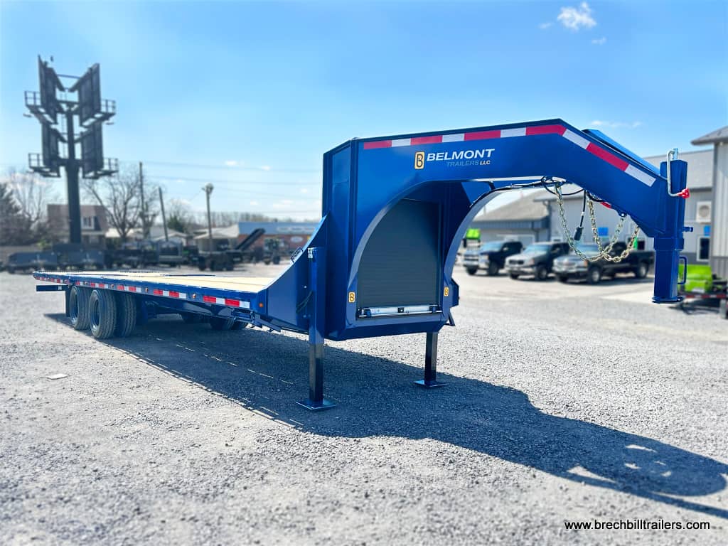 A blue Belmont 26K Hydraulic Dovetail Gooseneck Trailer 8.5x32