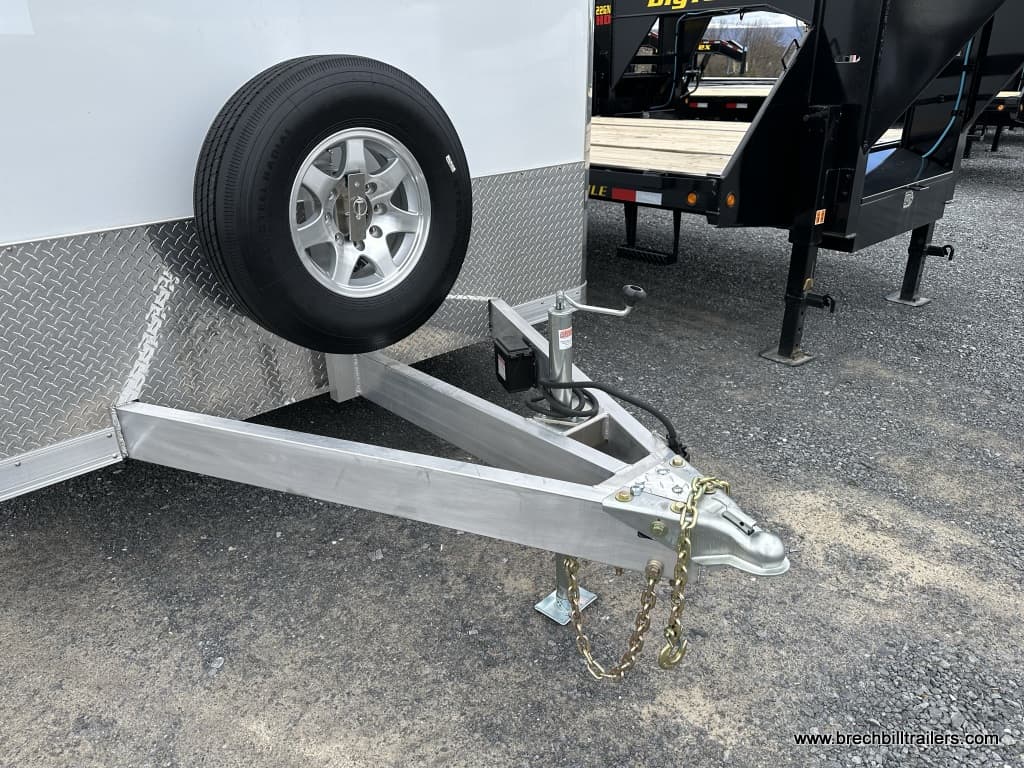 The trailer coupler and spare tire mounted on the front.