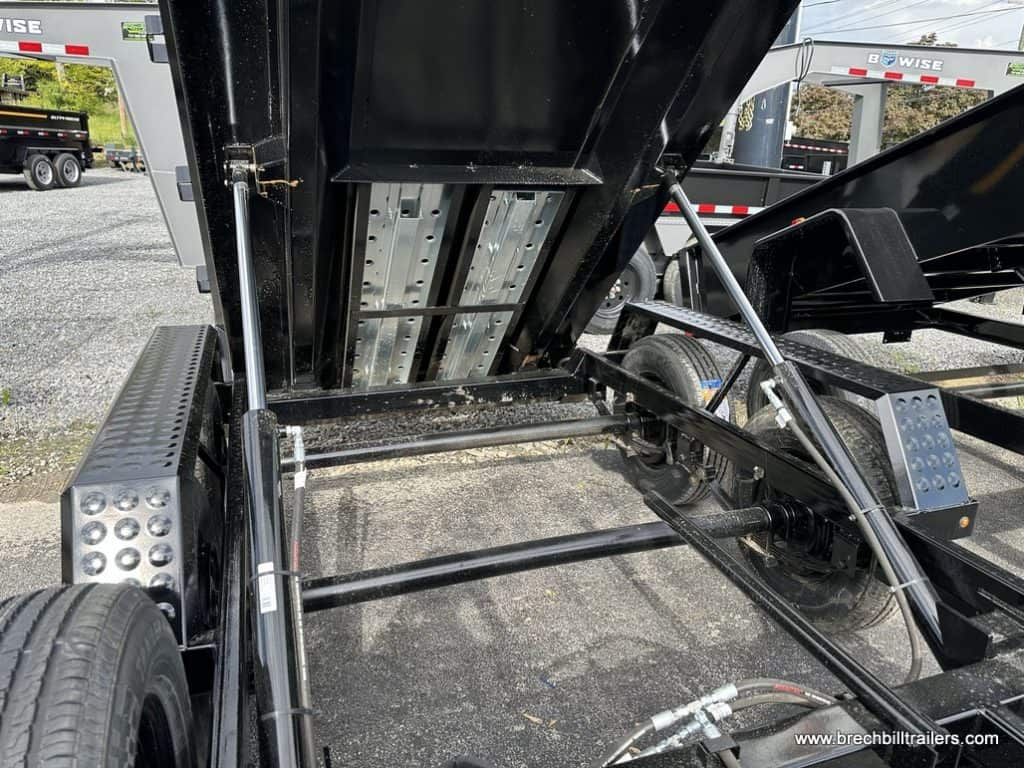 Display of cylinders extended to dump the trailer load