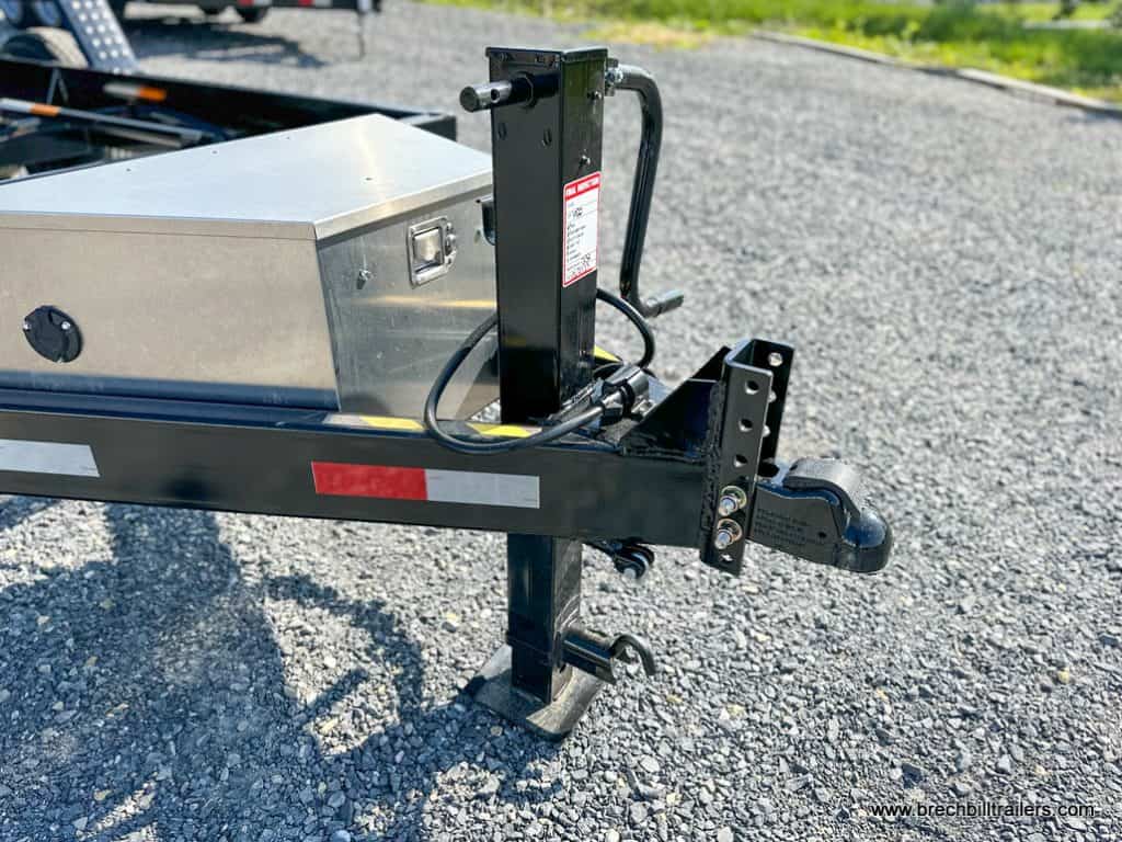 Trailer parked and detached being held up by its jack.