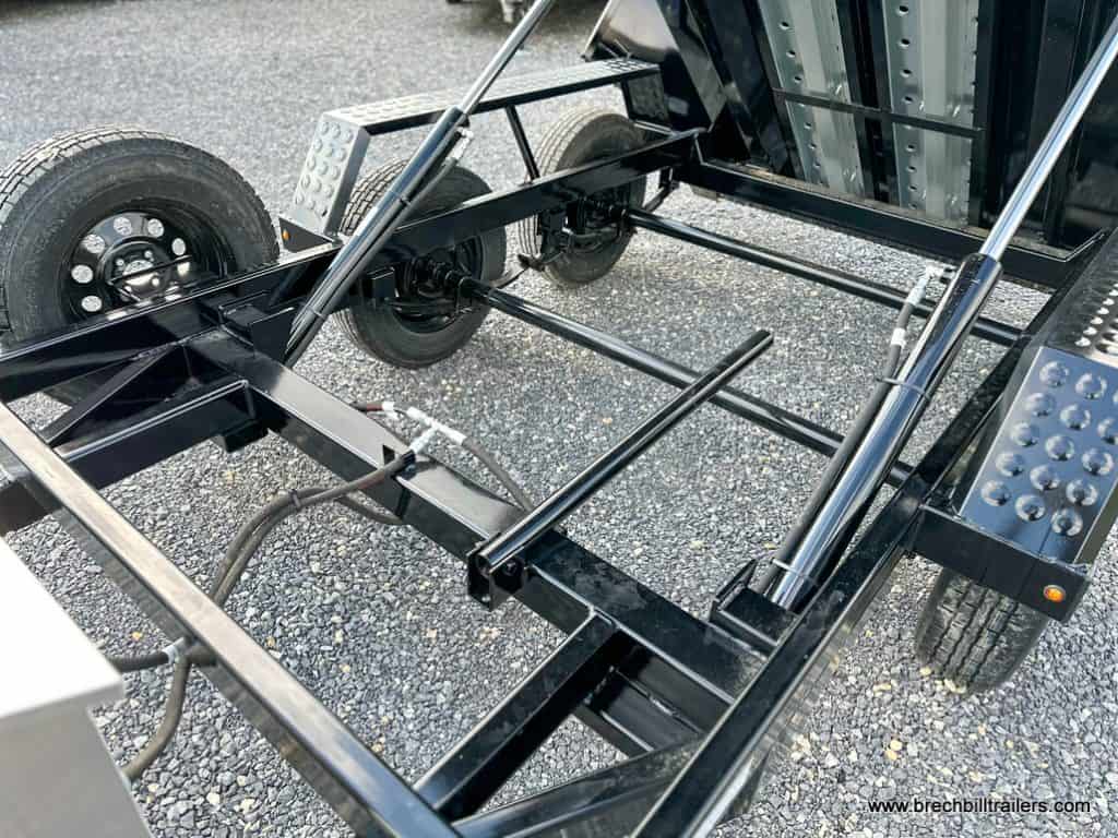 Hydraulic cylinders fully extended to raise bed and view the black frame.