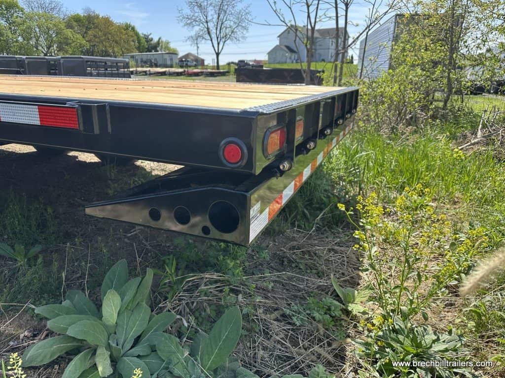 Bwise 19K THD Hydraulic Tilt-Deck Gooseneck Trailer for sale in the lot.