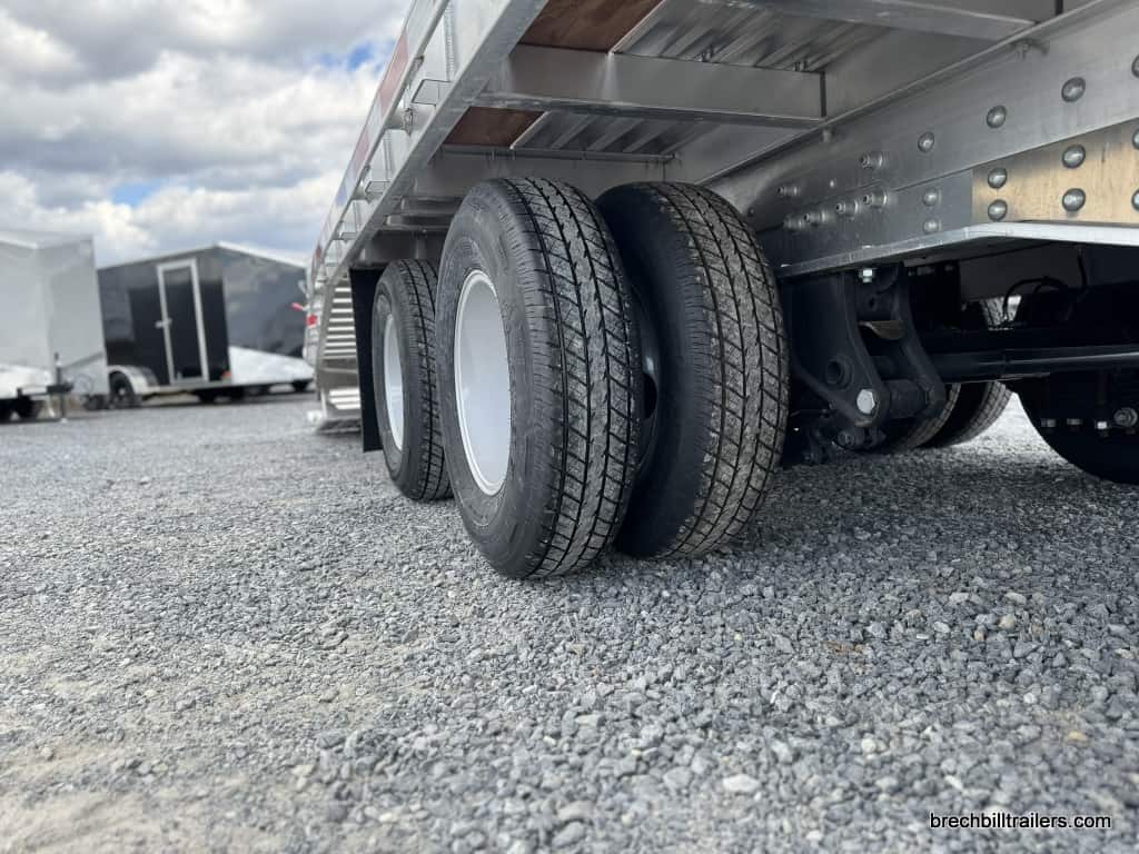 Axles and wheels on the EBY 25K Deck-Over Gooseneck Equipment Trailer