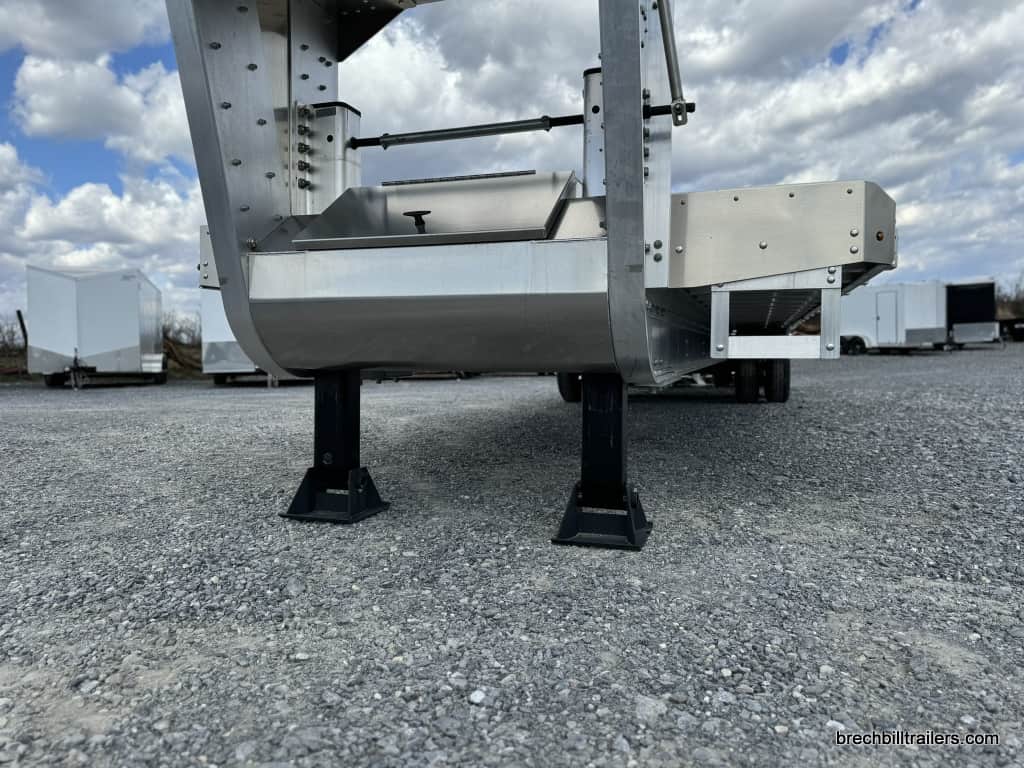 EBY 25K Deck-Over Gooseneck Equipment Trailer parked.