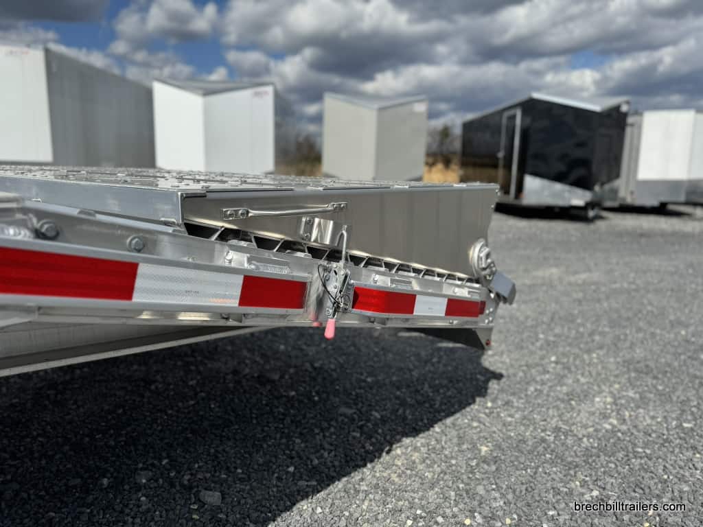Closeup of the aluminum ramps folded up on the trailer.