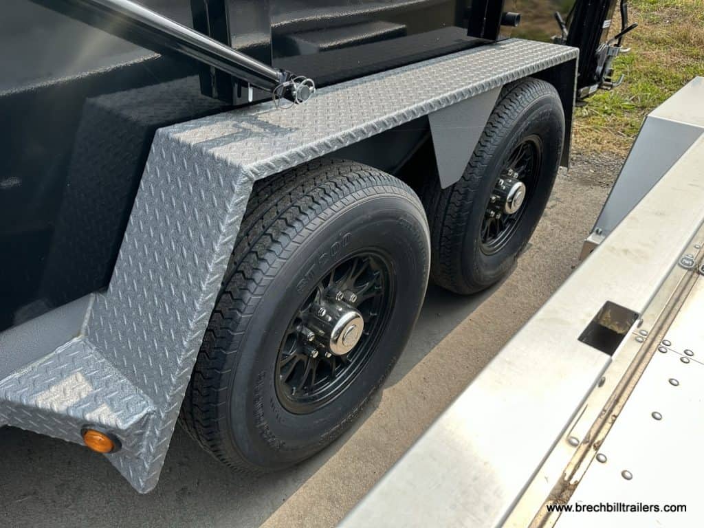 Black wheels and silver fender on the Bwise DU Ultimate Dump Trailer