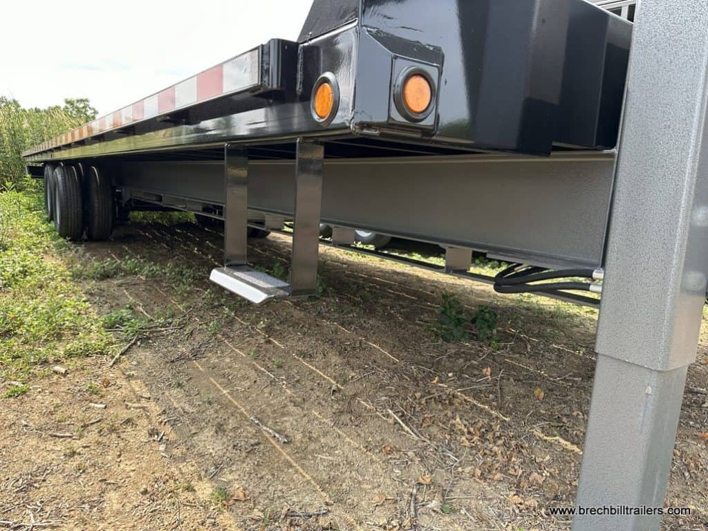 Looking down the side of a Bwise 26K Hydraulic Tilt Deck Over Trailer