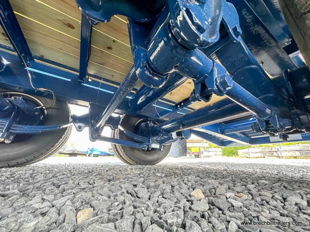All blue frame shown from under the Belmont 26K Heavy Duty Gooseneck Trailer