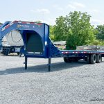 A parked 30ft Belmont 26K Heavy Duty Gooseneck Trailer