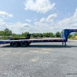 A blue Belmont 26K Heavy Duty Gooseneck Trailer 102"x30' (GNX30-24K)