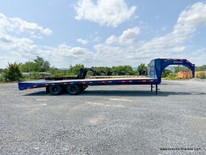 A blue Belmont 26K Heavy Duty Gooseneck Trailer 102"x30' (GNX30-24K)