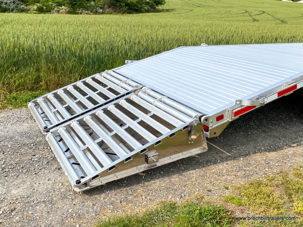 Ramps down for easy loading on a EBY 16K Deck-Over Gooseneck Equipment Trailer