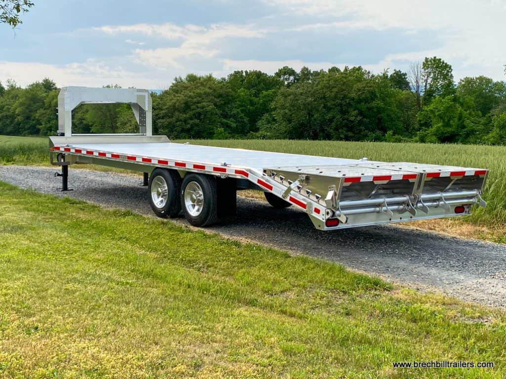 Side view of EBY 16K Deck-Over Gooseneck Equipment Trailer