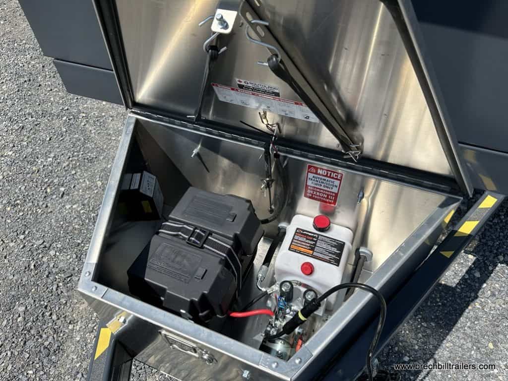 The Southland 15K Tandem Axle Dump Trailer hydraulic and battery area