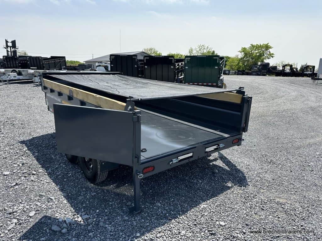 The Southland 15K Tandem Axle Dump Trailer with the tarp covering the bed.