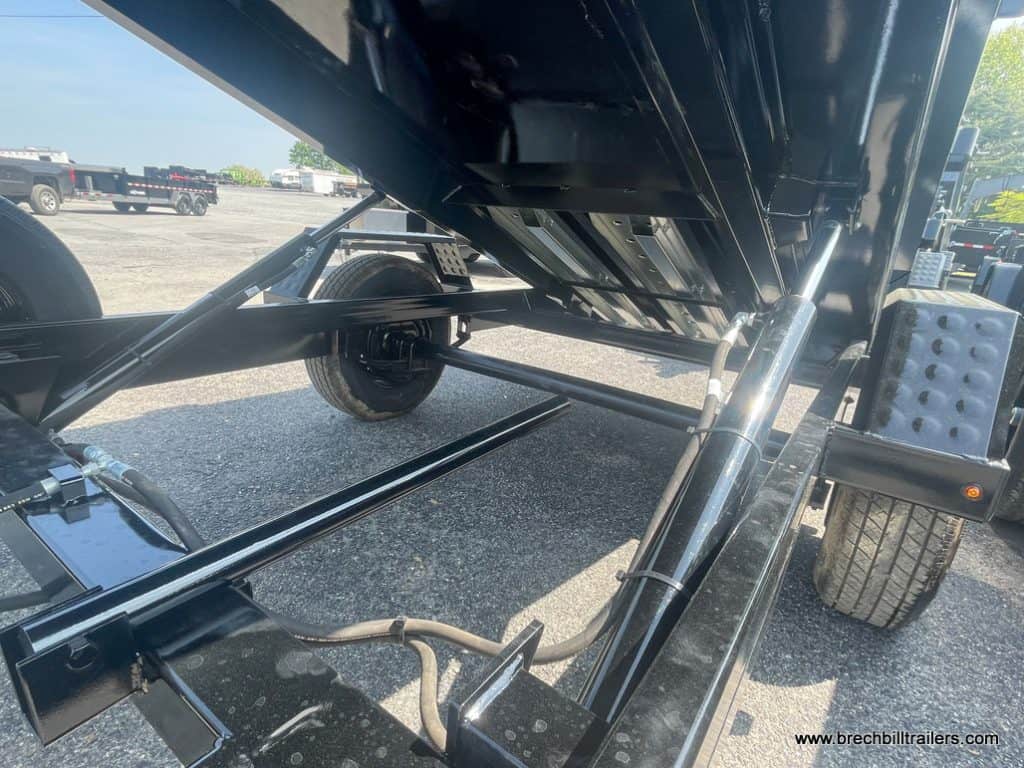 Hydraulic cylinders holding up the trailer into the dump position.