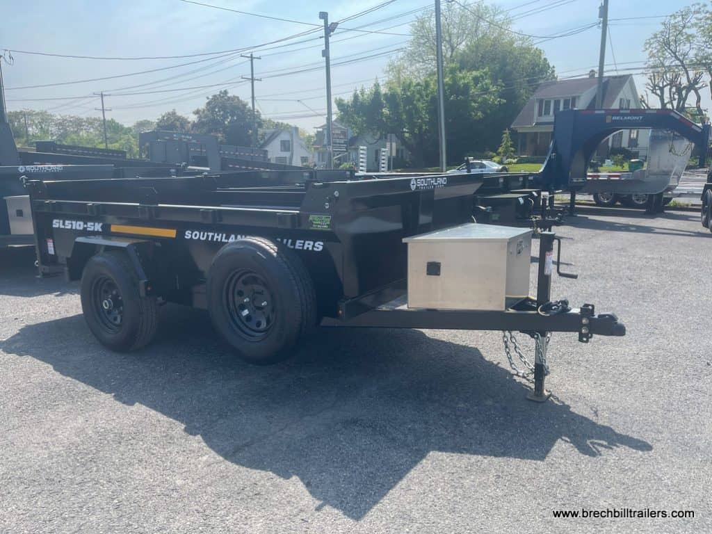 A Southland 5K Single Axle Dump Trailer with a spare tire and toolbox
