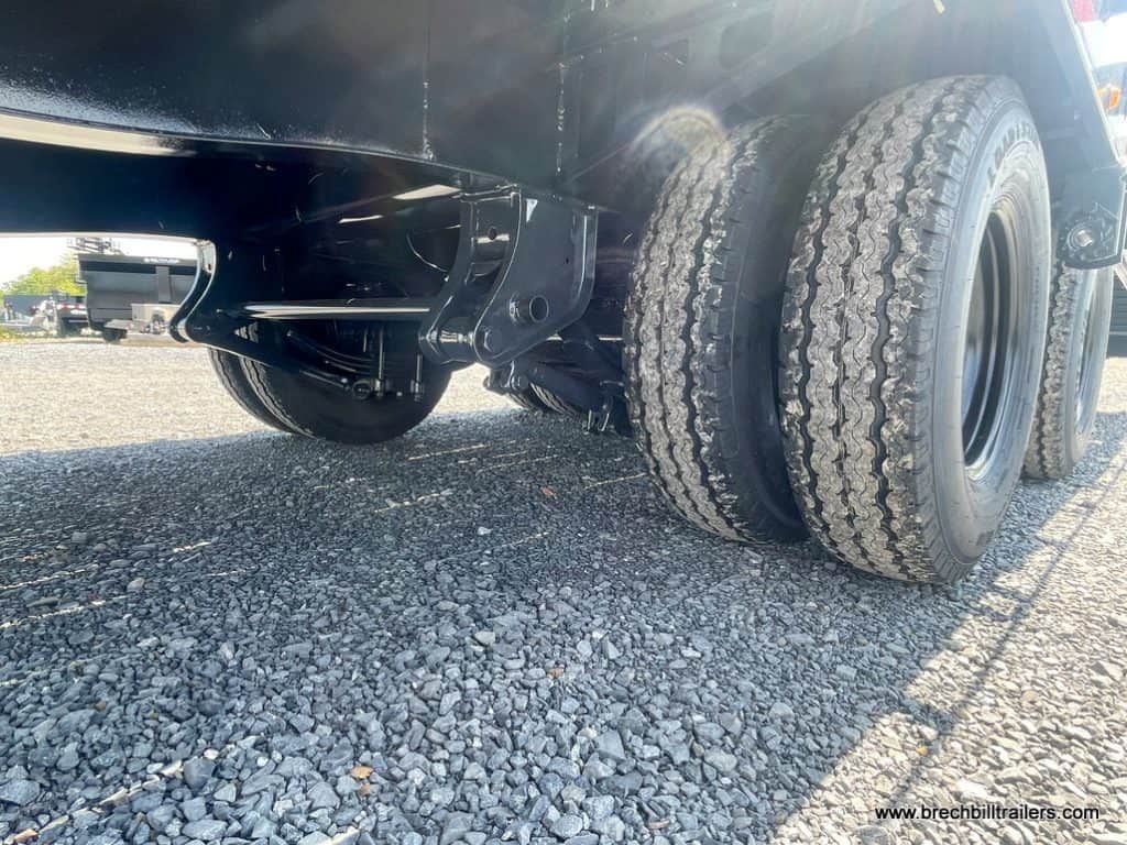 Wheels and axles seen from below the trailer.