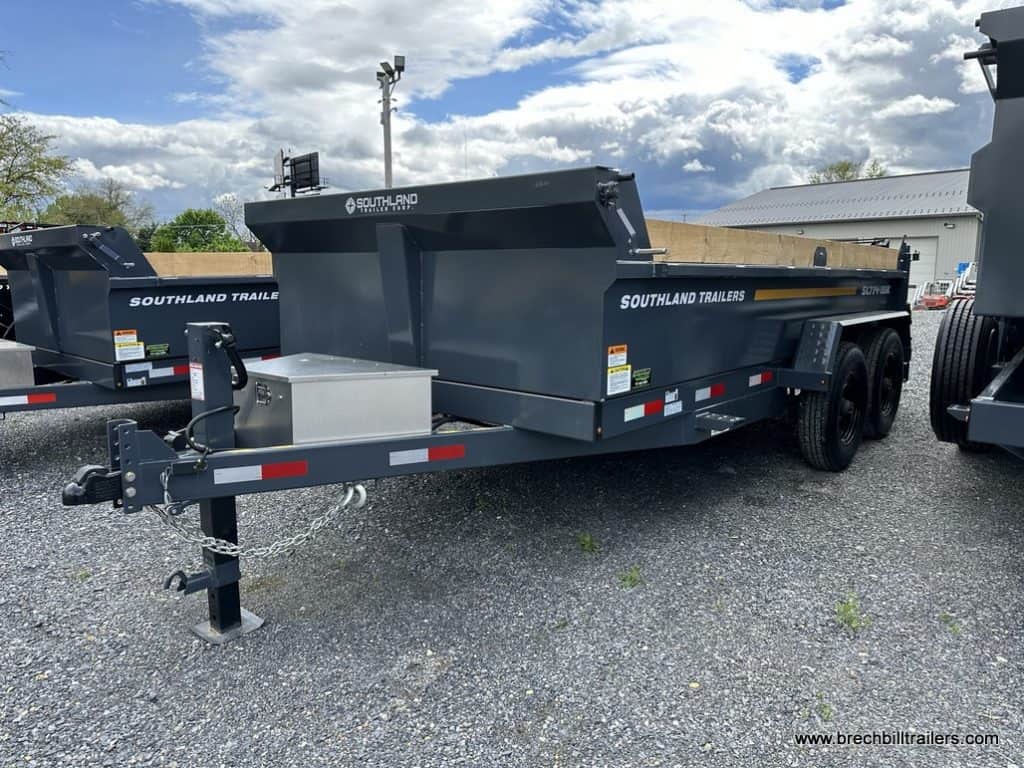 Southland 16K Tandem Axle Dump Trailer with toolbox mounted on the front of it.