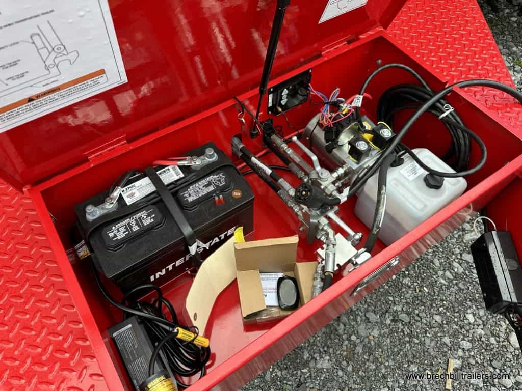 Toolbox and hydraulic fluid reservoir.