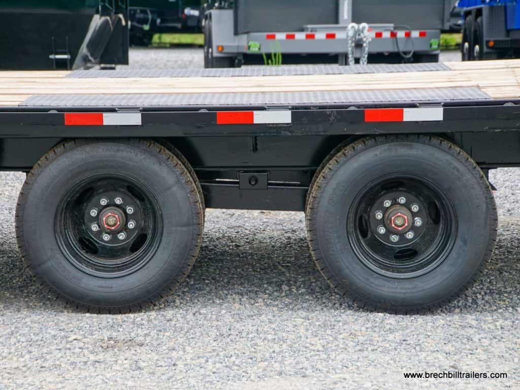 The trailer's wheels viewed from the side.