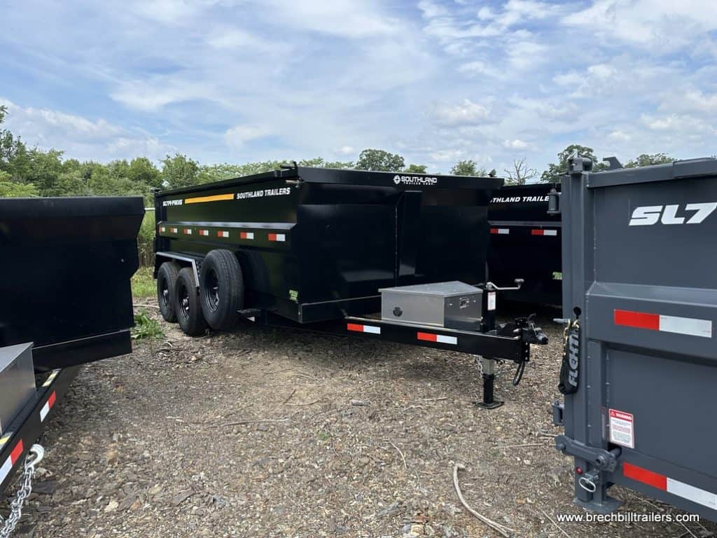 A brand new Southland 15K Tandem Axle High Side Dump Trailer parked in the lot.