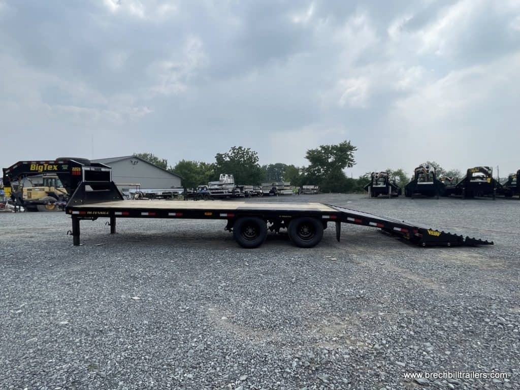 Side of a Big Tex gooseneck trailer with its ramps down.