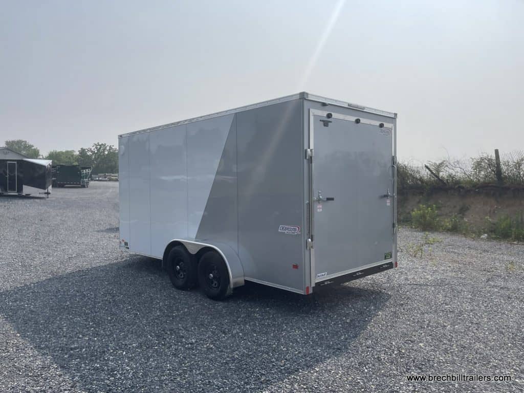 Side of a white and silver Bravo Scout 7K Enclosed Cargo Trailer