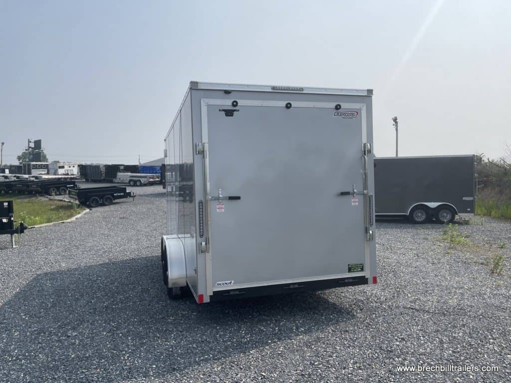 A brand new Bravo Scout 7K Enclosed Cargo Trailer seen from the back