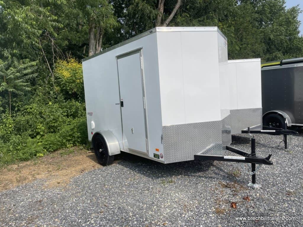 A parked Bravo Scout 3K Enclosed Cargo Trailer at the Brechbill Trailers lot.