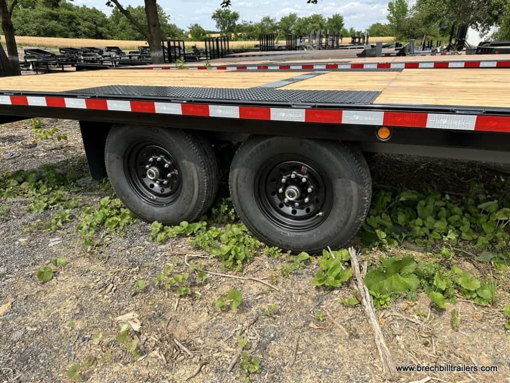 Black wheels on the Bwise 15.4K Hydraulic Tilt-Deck Trailer