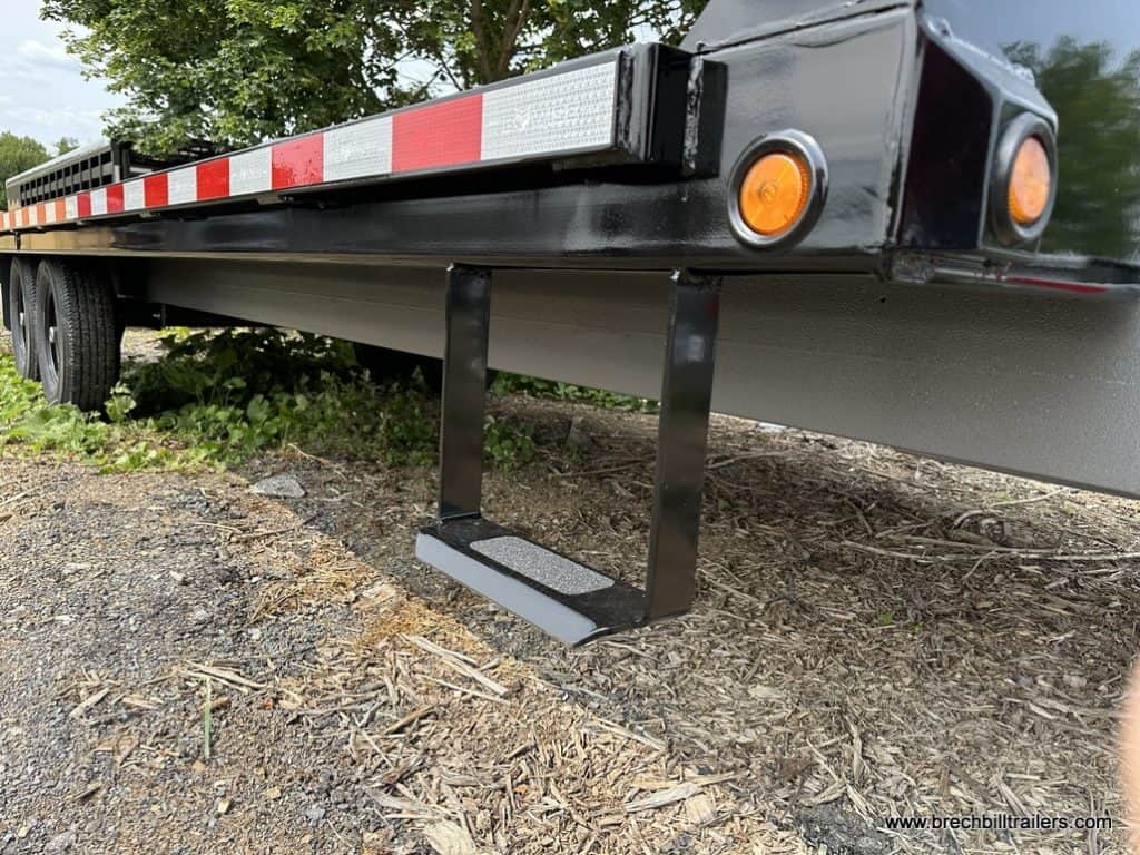 Step up on the side of the Bwise 15.4K Hydraulic Tilt-Deck Trailer