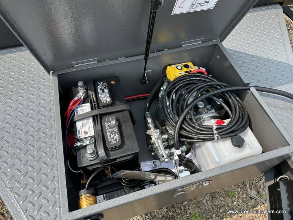Battery box with hydraulic system inside the Bwise 15.4K Hydraulic Tilt-Deck Trailer