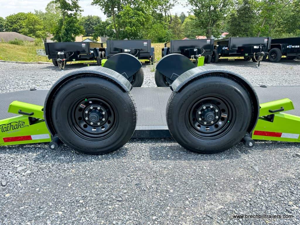 Close-up of the trailer's sturdy wheels, providing reliable support and stability during transportation FlatTrak Trailer Flat Track