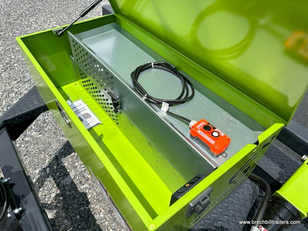 A lockable A-Frame toolbox on the trailer, offering convenient storage for tools and accessories, Remote for rase and lower deck