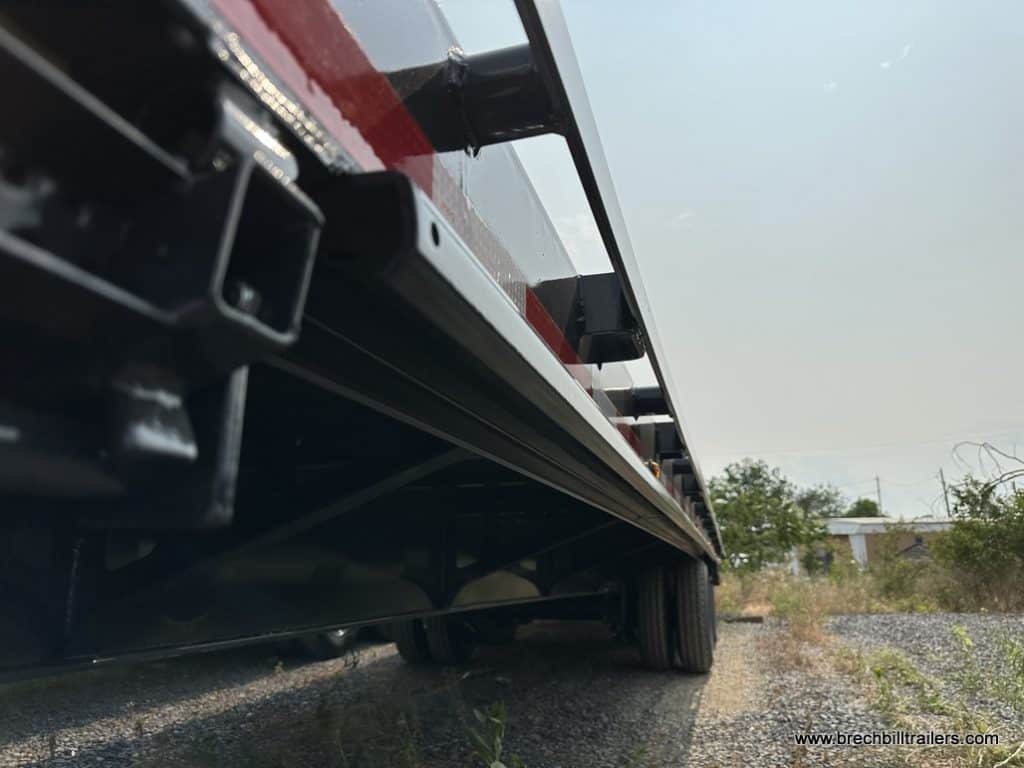 Looking down on the side of the Belmont 26K Hydraulic Dovetail Gooseneck Trailer