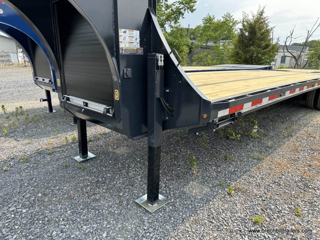 Belmont 26K Hydraulic Dovetail Gooseneck Trailer on stands while parked.