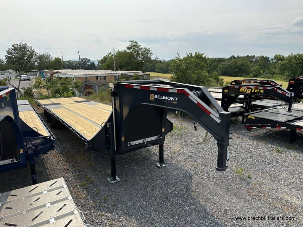 A few Belmont 26K Hydraulic Dovetail Gooseneck Trailers in the lot.