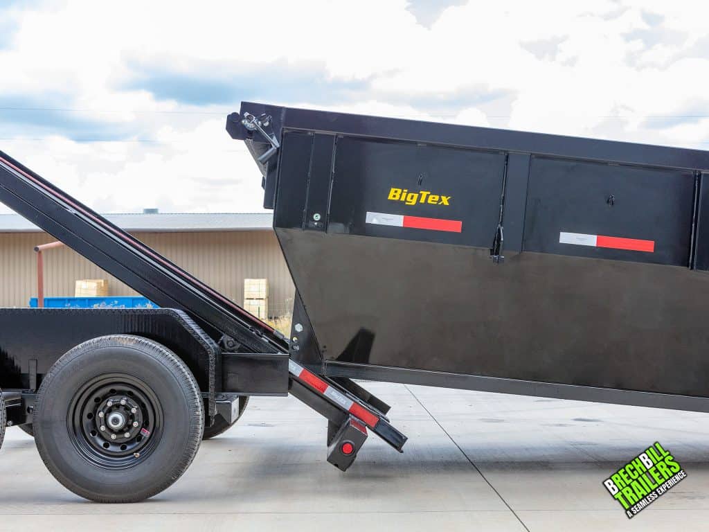 Big Tex Roll Off Trailer Bin getting loaded on to a truck