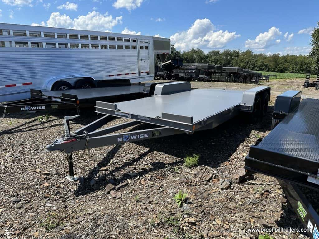 A brand new Bwise 7K Car-Hauler Trailer parked at the Brechbill Trailers lot.