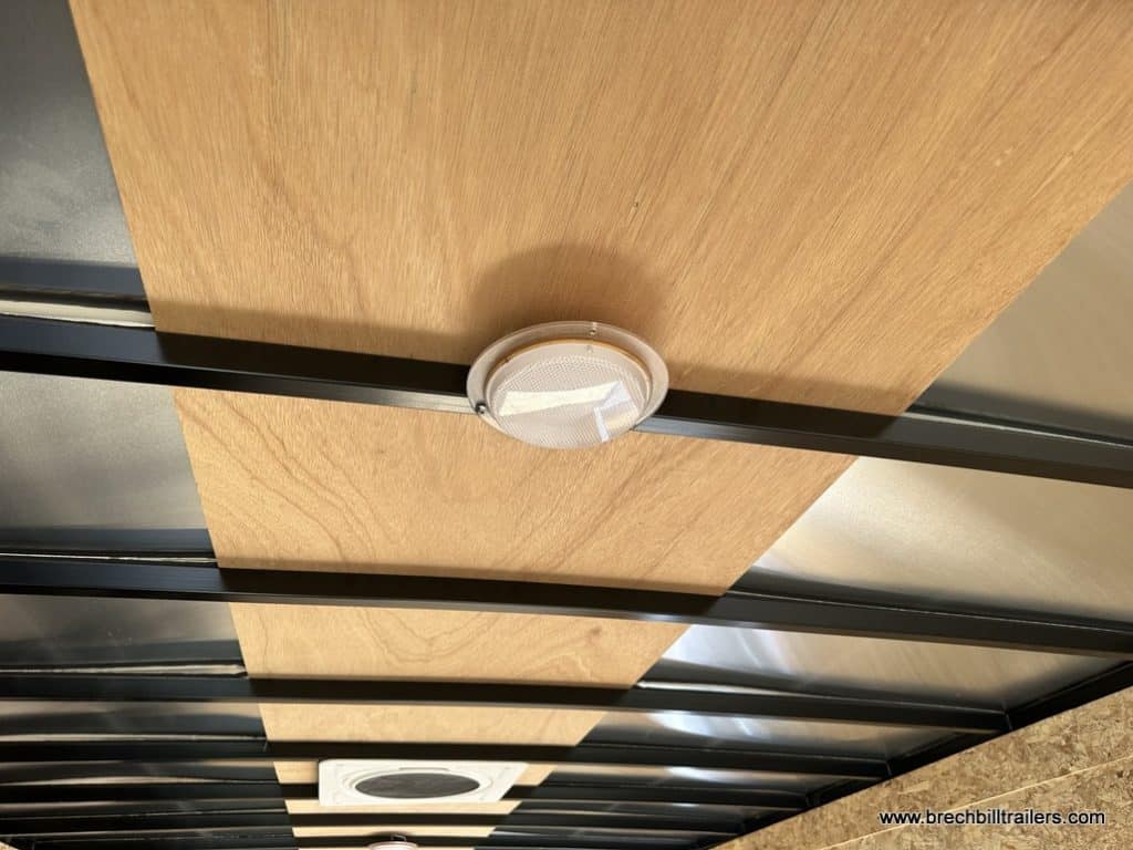 Light on the ceiling inside the cargo trailer.