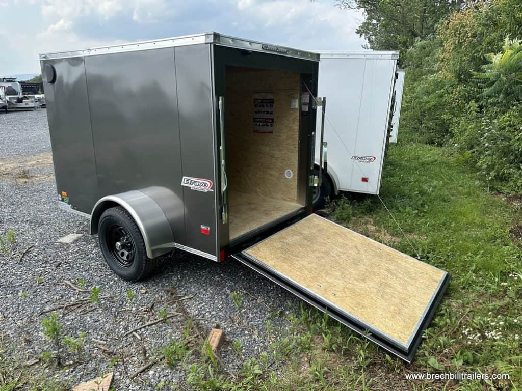 Brand new Bravo 3K Scout Enclosed Cargo Trailer with ramp down for display.
