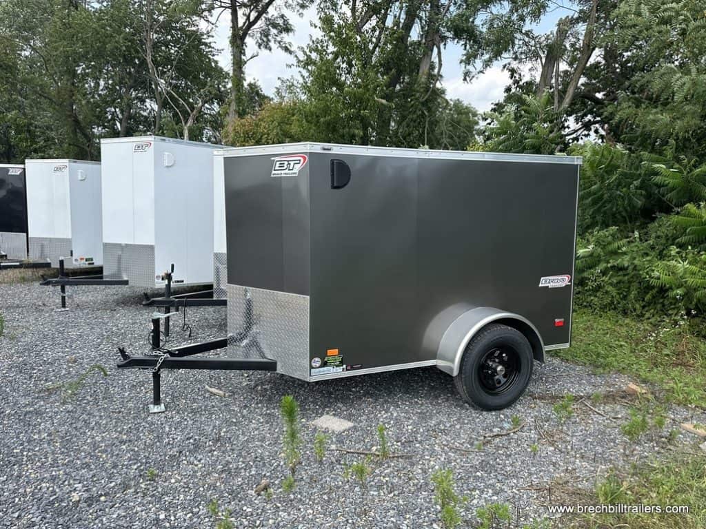 A charcoal gray parked Bravo 3K Scout Enclosed Cargo Trailer