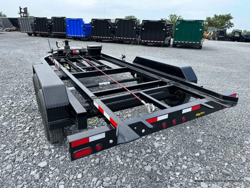 A parked Big Tex 14K Roll Off Bumper Pull Dump Trailer