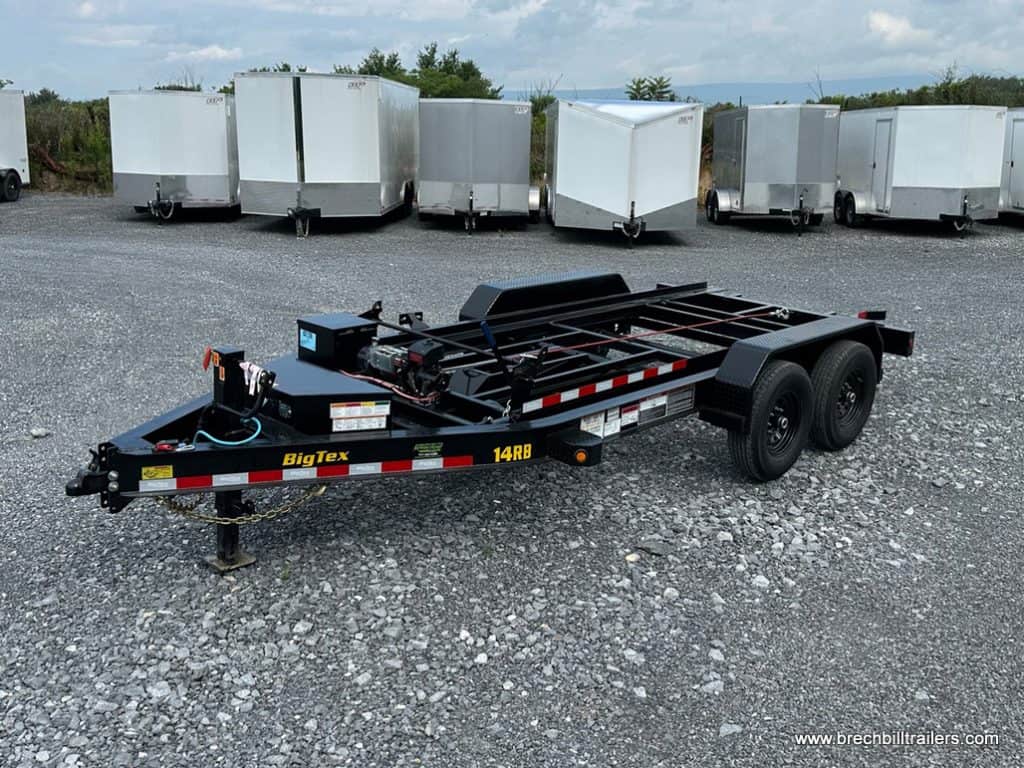 Front of a new Big Tex 14K Roll Off Bumper Pull Dump Trailer parked on gravel.