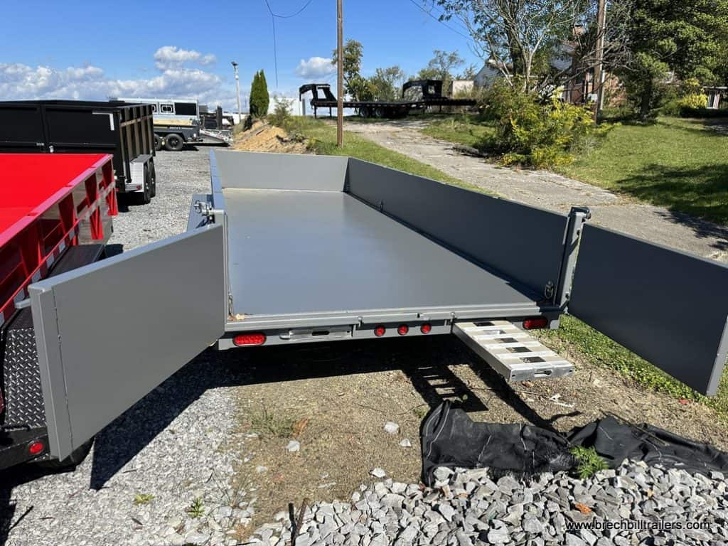 A Bwise 21K DLP Heavy Duty Dump Trailer with ramp coming out the back.