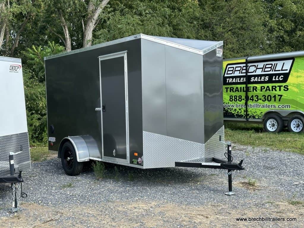 A brand new Bravo Scout 3K Enclosed Cargo Trailer parked and ready to sell.